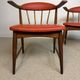 Pair of Scandinavian armchairs in teak and red faux leather – 1960s