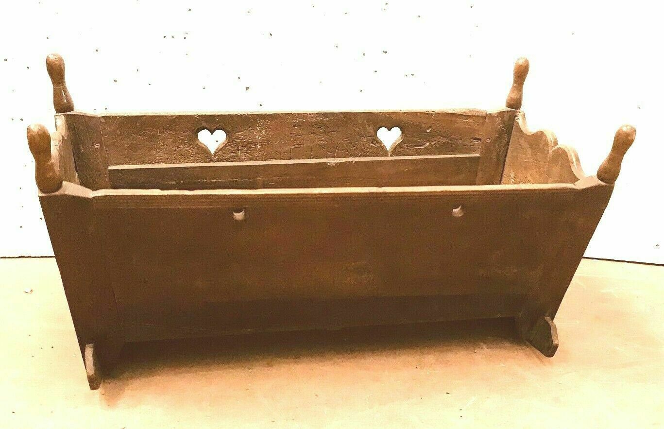 Sculpted walnut rocking cradle