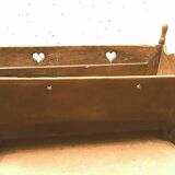 Sculpted walnut rocking cradle