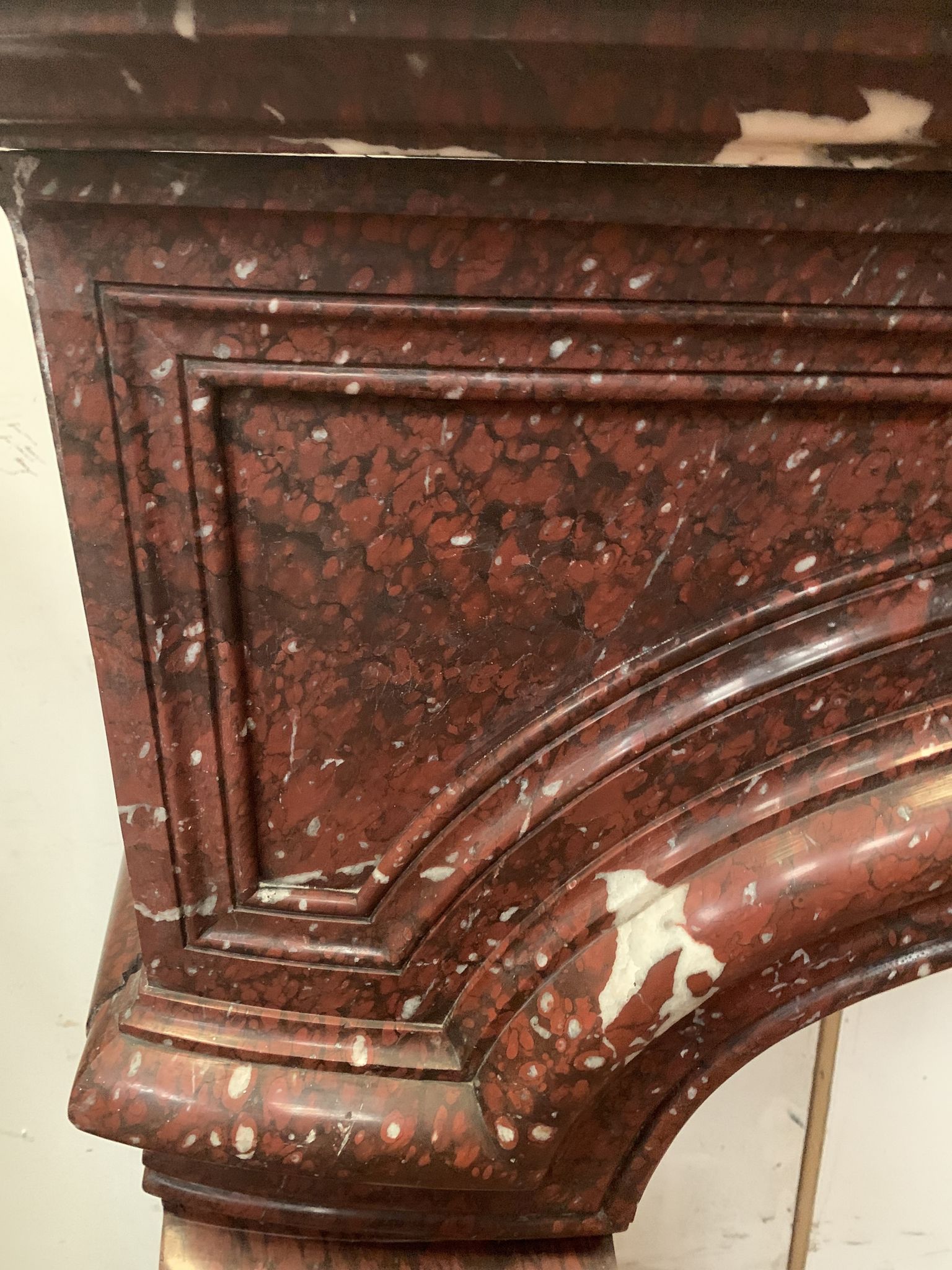 Pair of Louis XIV style fireplaces in red cherry marble. XIX century.