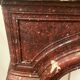 Pair of Louis XIV style fireplaces in red cherry marble. XIX century.