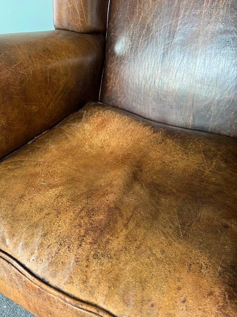 Vintage armchair in patinated sheep leather