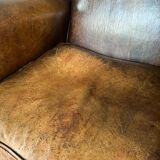 Vintage armchair in patinated sheep leather