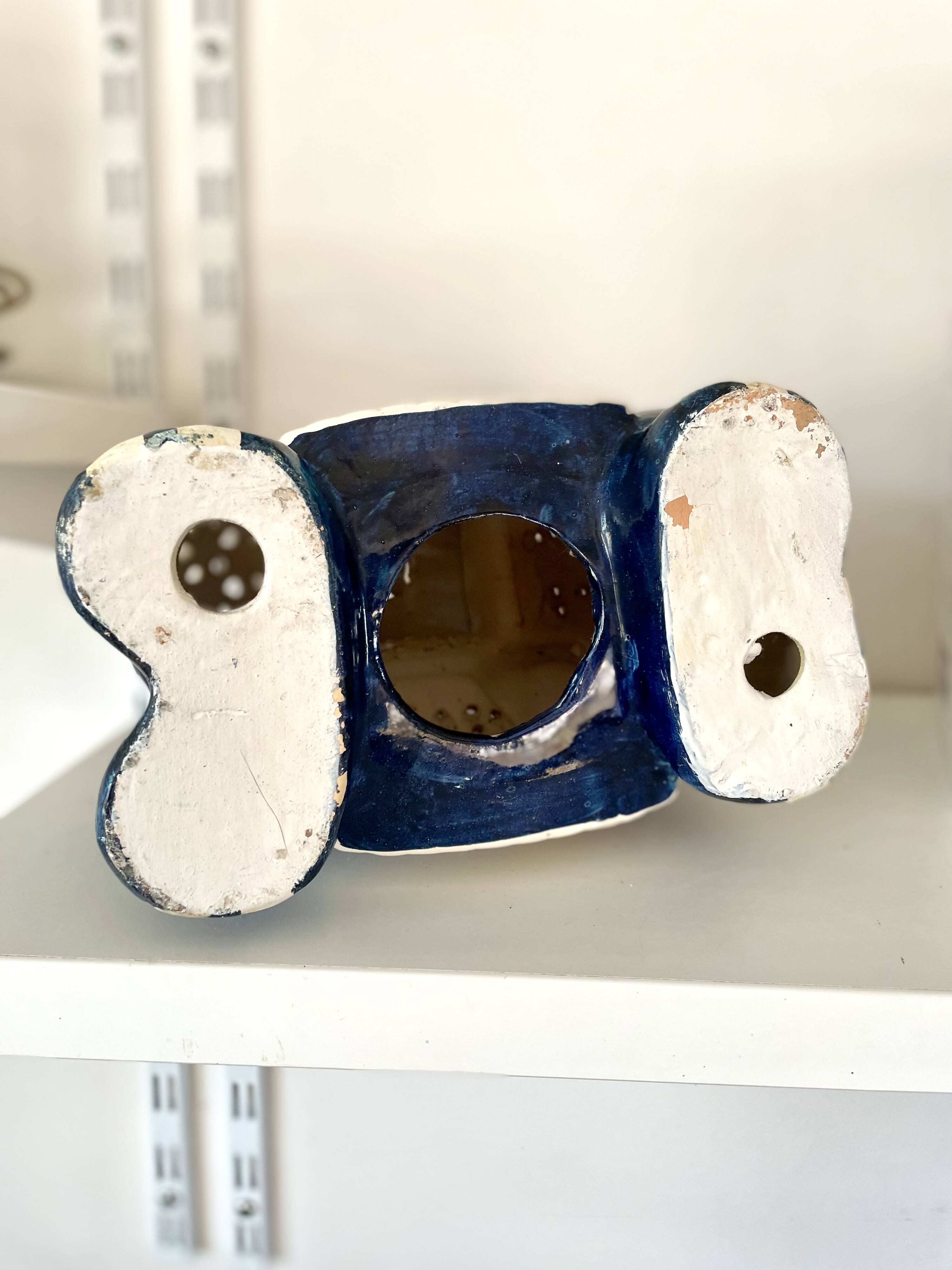 Blue and red ceramic elephant plant stand