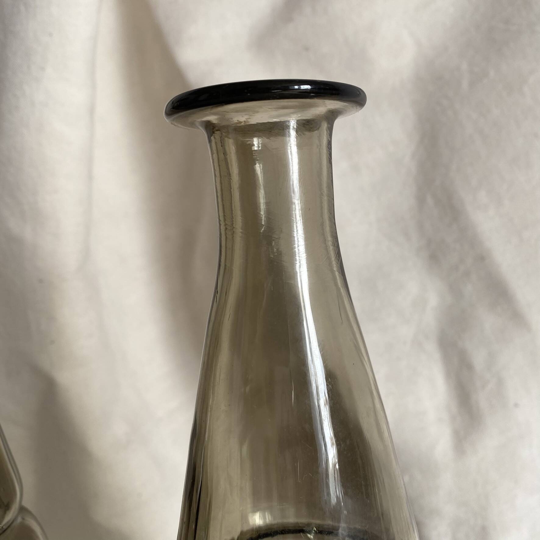 Pair of antique smoked glass vases carafes