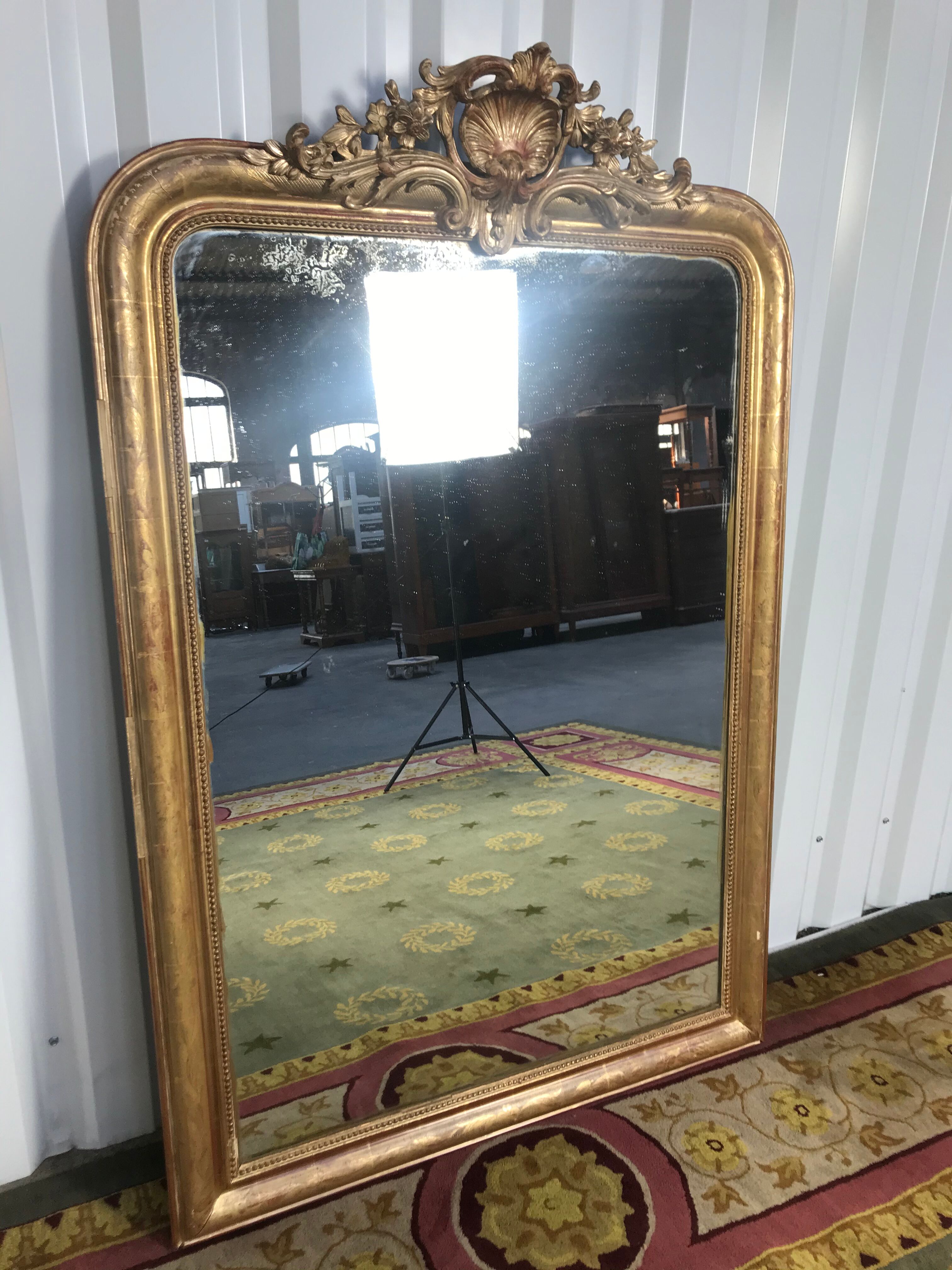 Louis Philippe's era mirror with a gold leaf pediment