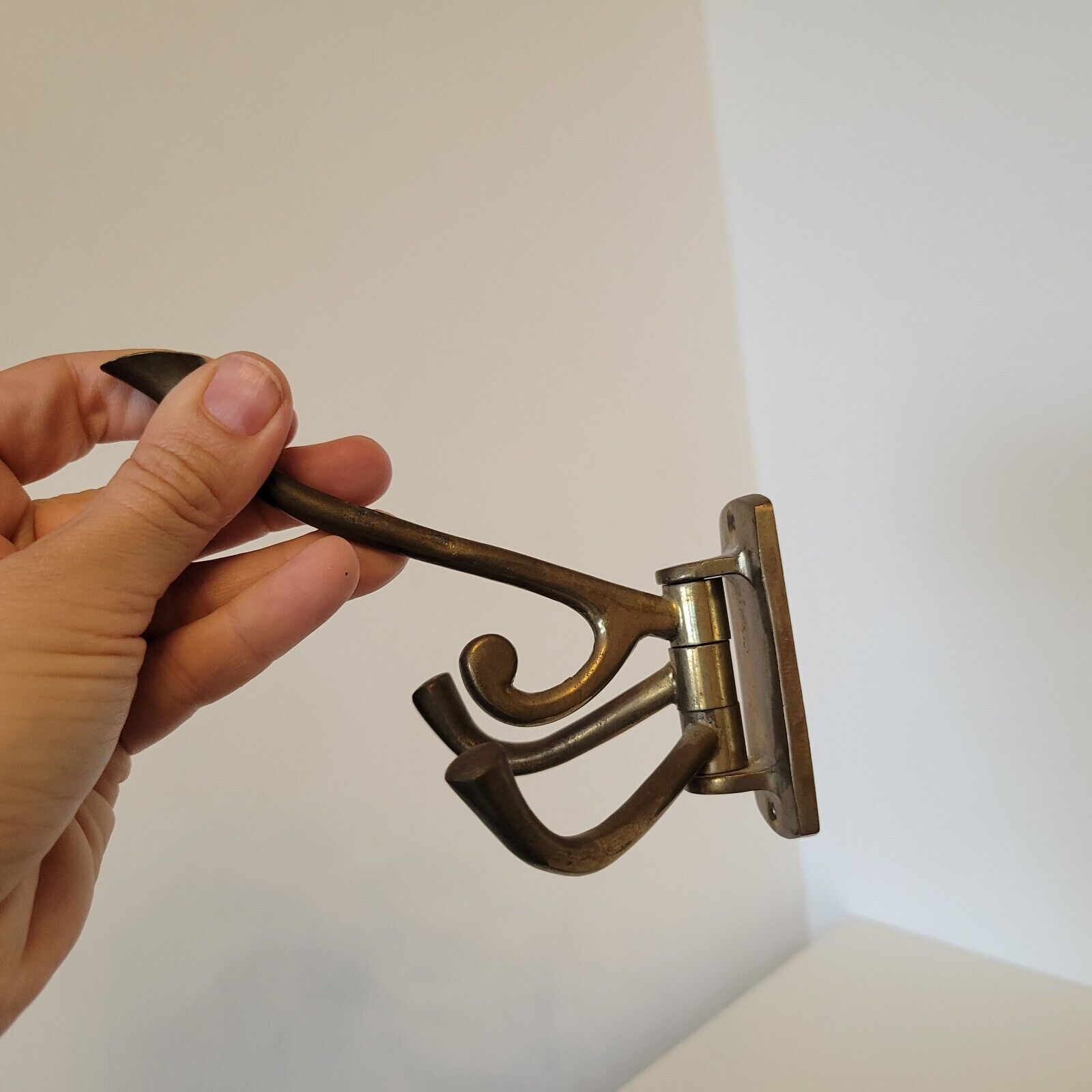 2 hooks with 4 rotating hooks each in brass