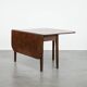 Charming antique English drop-leaf dining table made of oak from the late 19th century