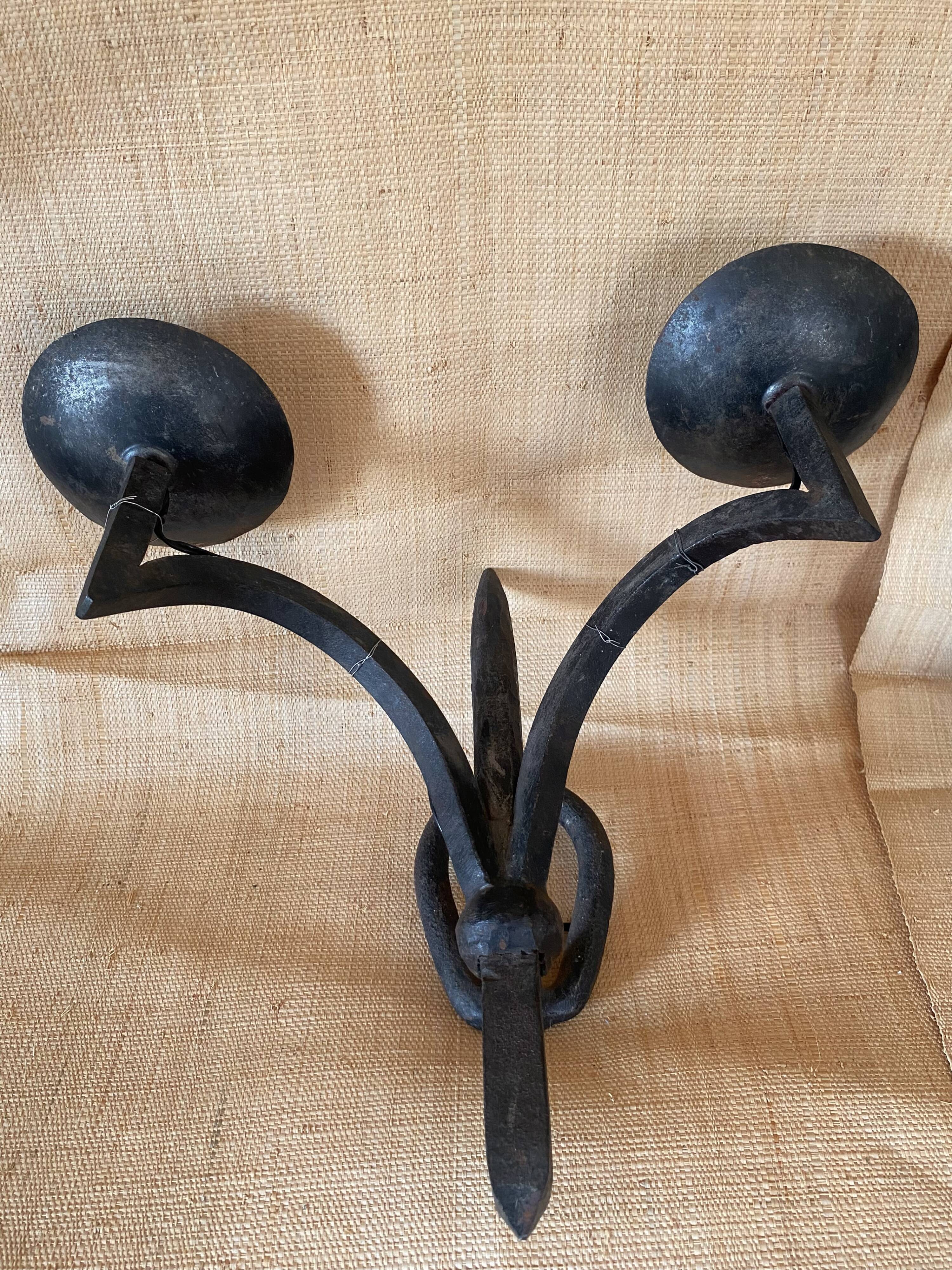Wrought iron wall lights.