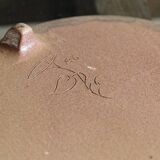 Sandstone trivet, signed