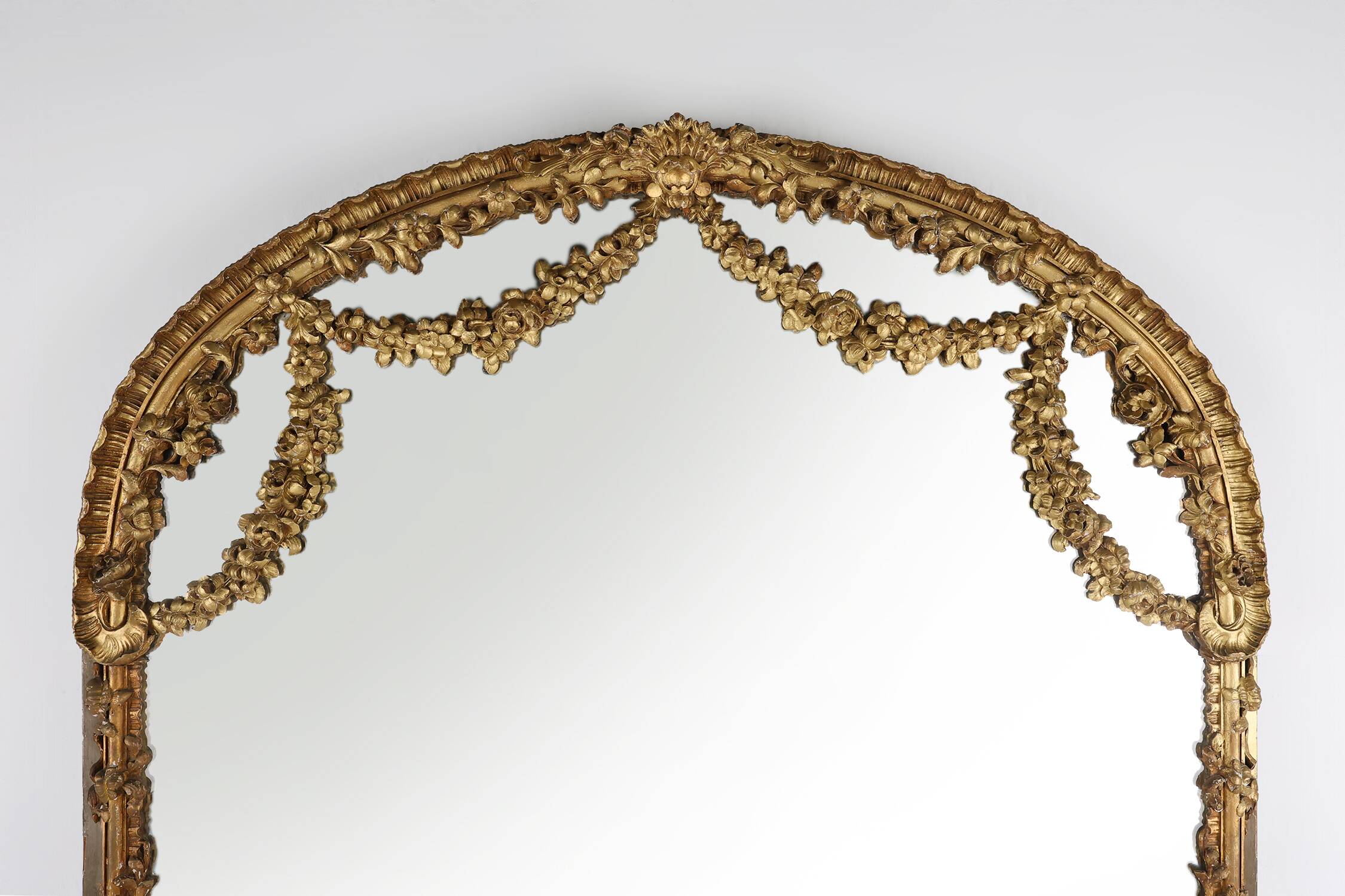 Large baroque decorated chimney mirror in gilted wood, France ca. 1800
