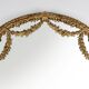 Large baroque decorated chimney mirror in gilted wood, France ca. 1800