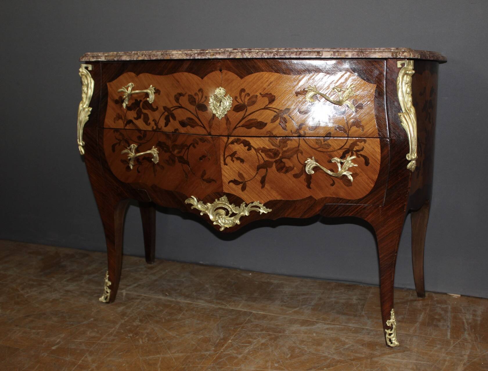 Louis XV style commode in marquetry from around 1930.