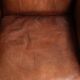 Sheepskin armchair with comfortable seat and finished with decorative nails