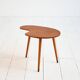 Biomorphic teak and brass side table from the 1950s–1960s