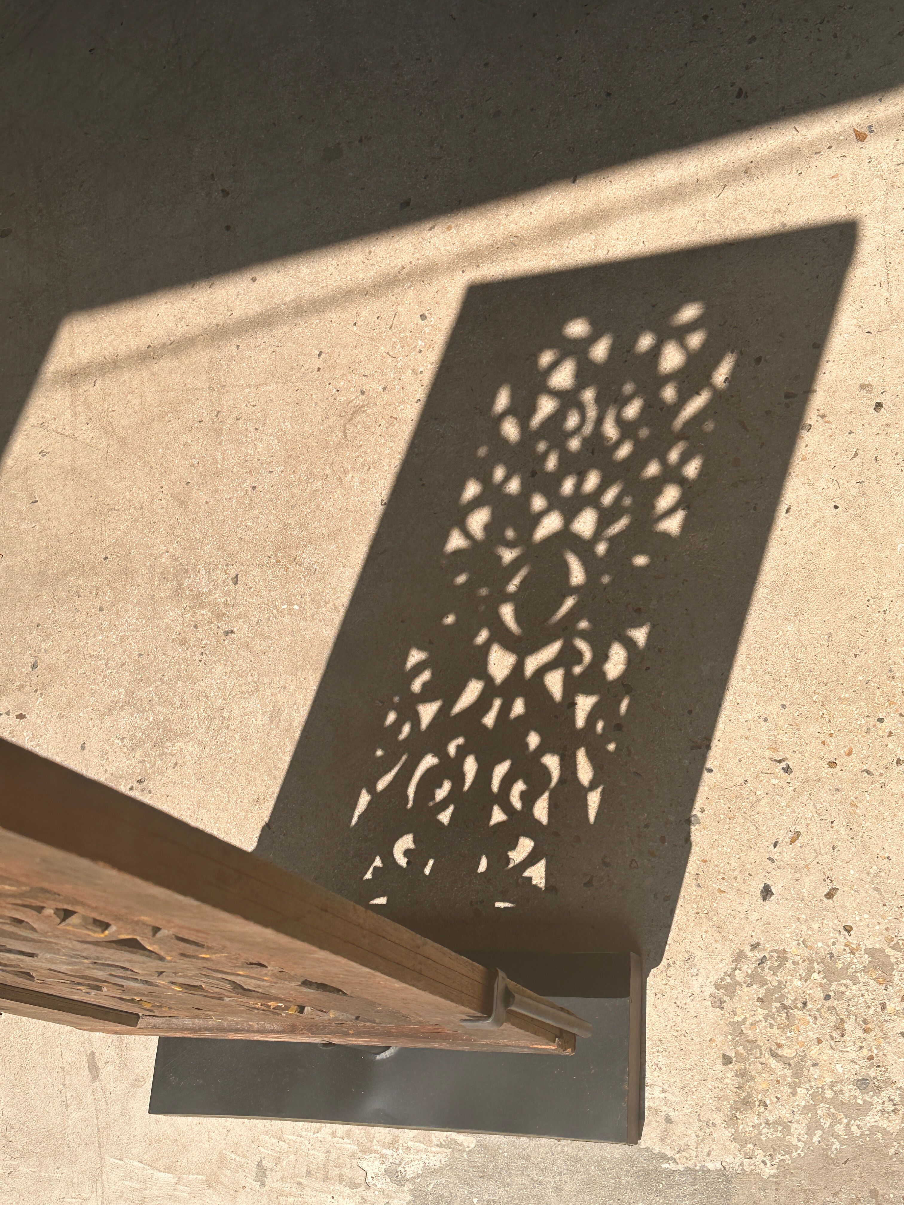 Rectangular Indonesian construction element with blue and yellow plant in carved wood