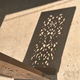 Rectangular Indonesian construction element with blue and yellow plant in carved wood