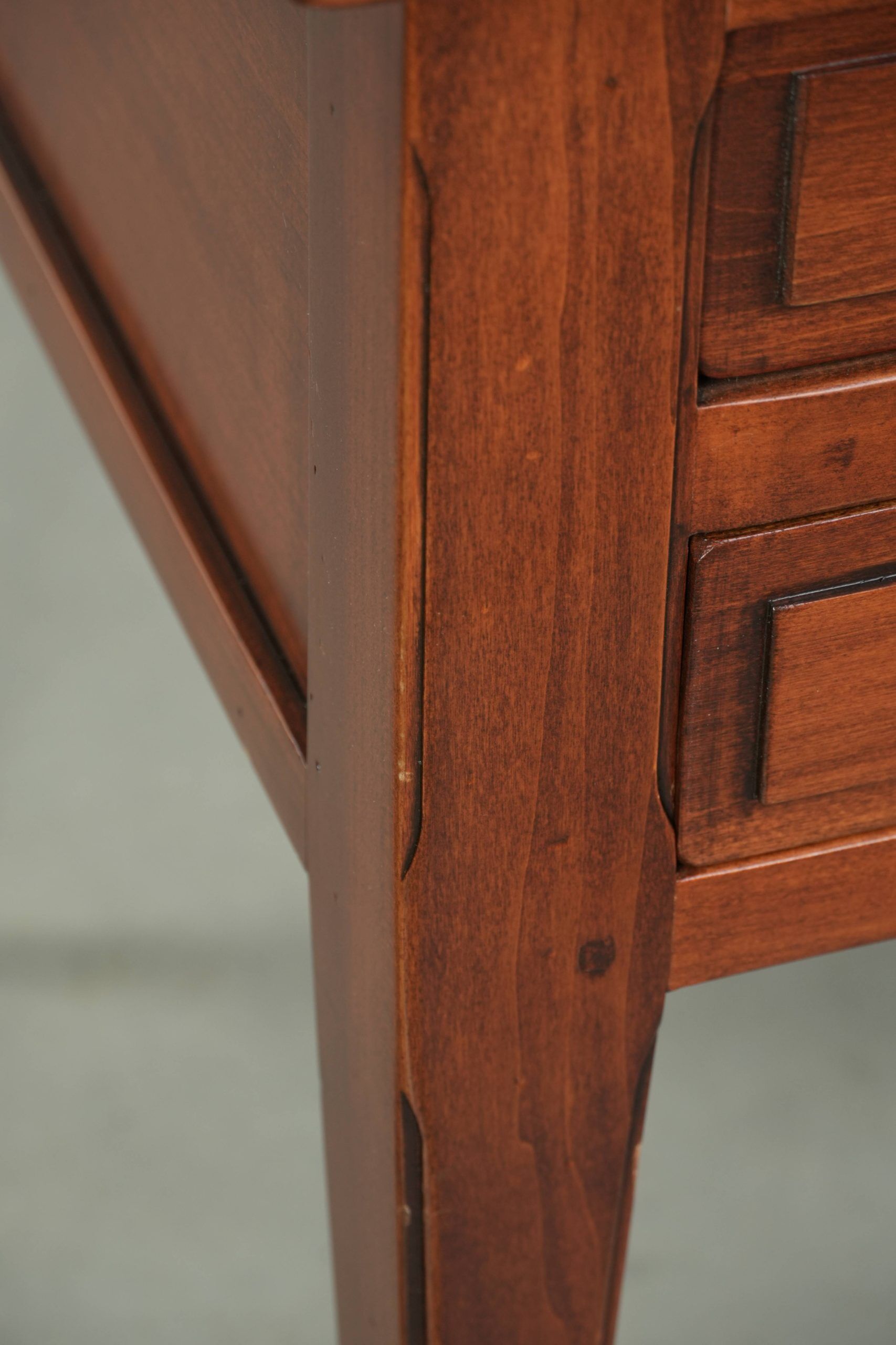 Elegant English style desk with green leather top, gold details and drawers