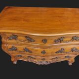 Solid wood commode in an antique style.