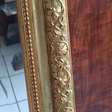 Antique mirror in wood and gilded stucco, neo Louis XVI style.