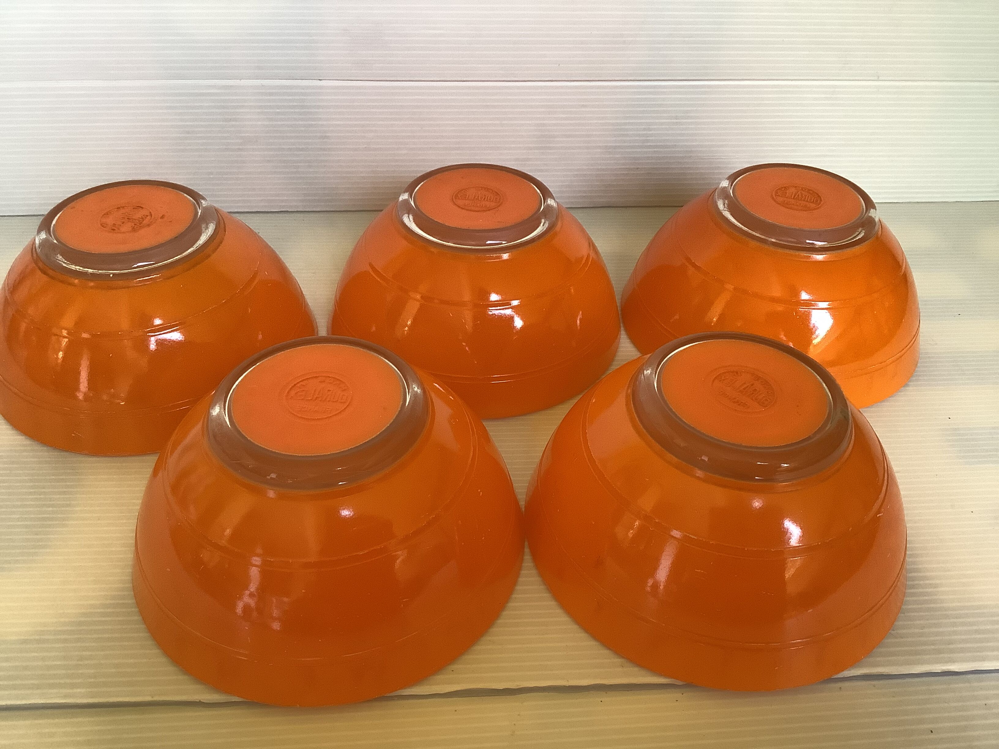 Five old orange duralex bowls