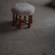 Pair of mid-century Danish oak stools with shearling lambswool upholstery, 1950s.