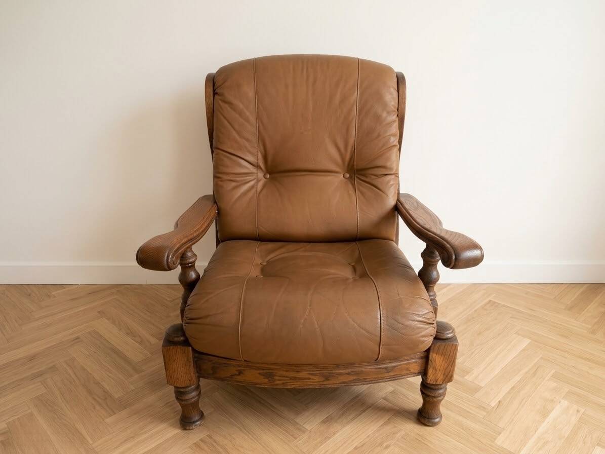 Pair of vintage 1970s armchairs in solid oak and cognac faux leather.