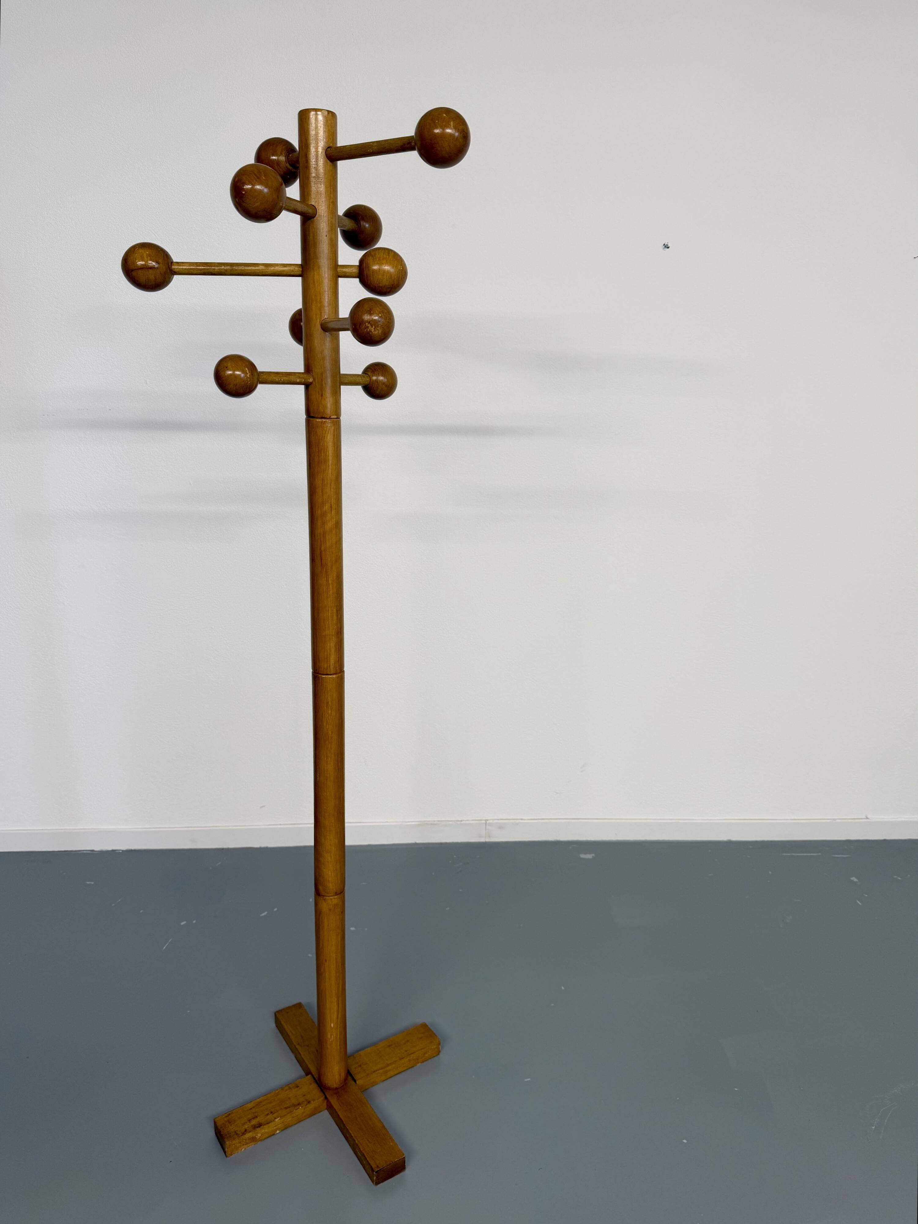 Vintage wooden coat stand with modernist design from the 1970s.