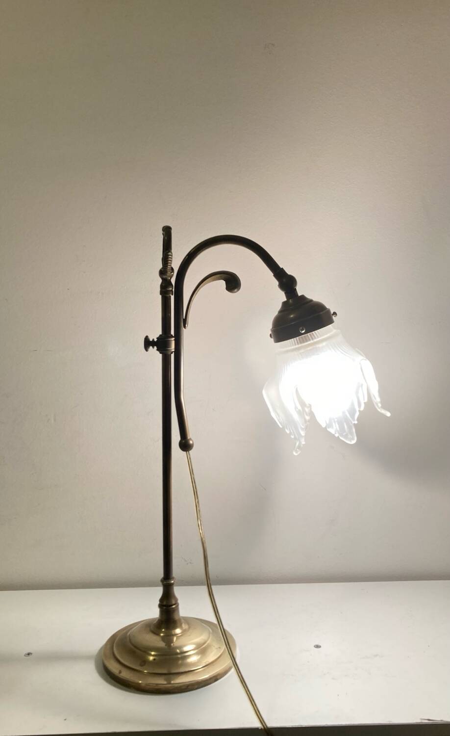 Brass table lamp with a glass shade