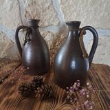 Dark brown stoneware jugs and pitchers with their cord