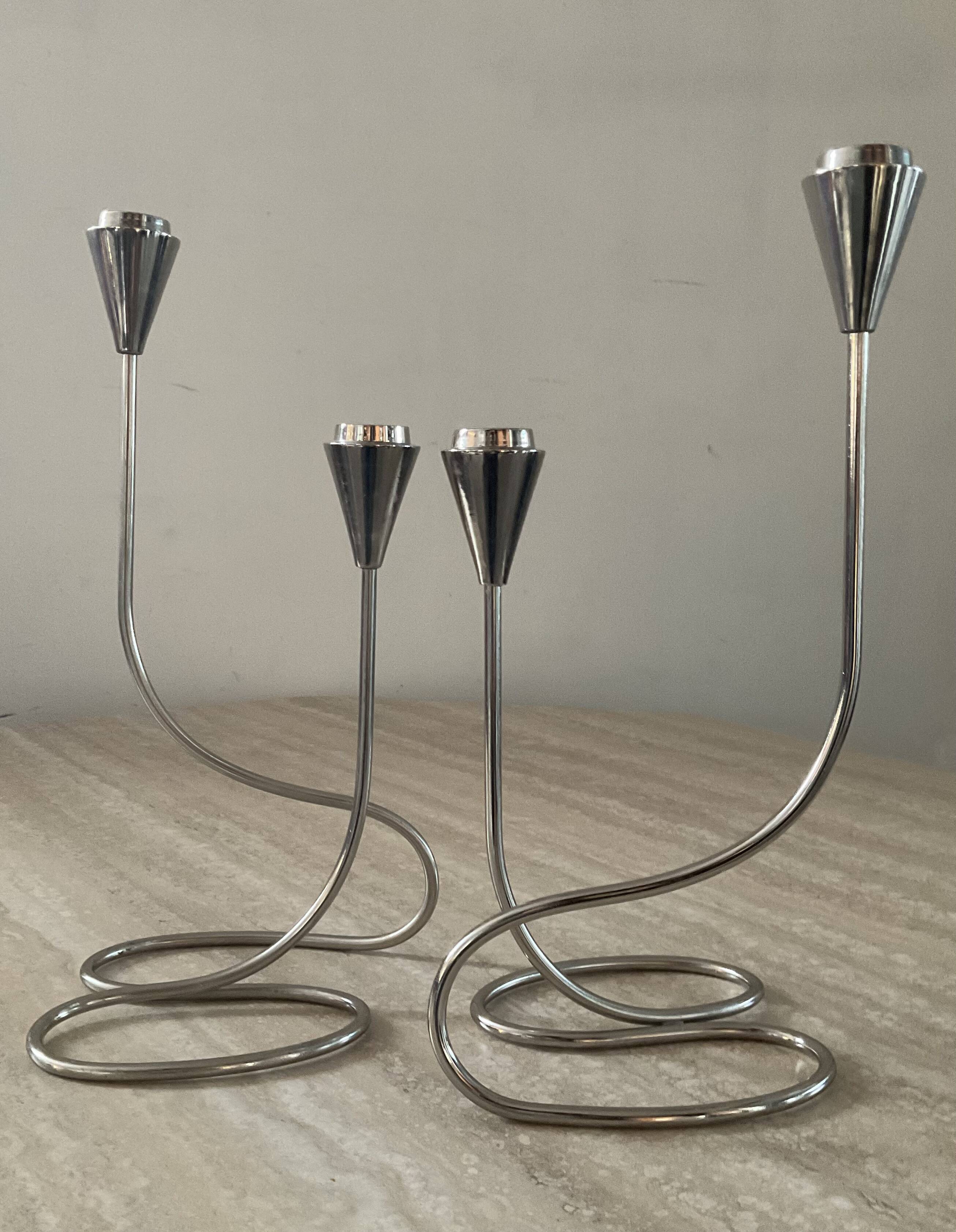 Pair of modernist silver metal candlesticks