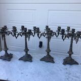 4 identical old brass candlesticks