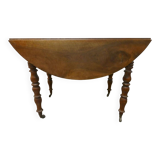 Walnut shuttered table, on casters