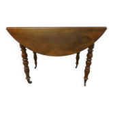 Walnut shuttered table, on casters