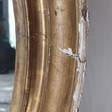 Antique oval gilded stucco mirror