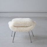 Womb Chair and Ottoman in fluffy white fabric by Eero Saarinen