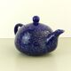 Blue glazed and speckled ceramic teapot