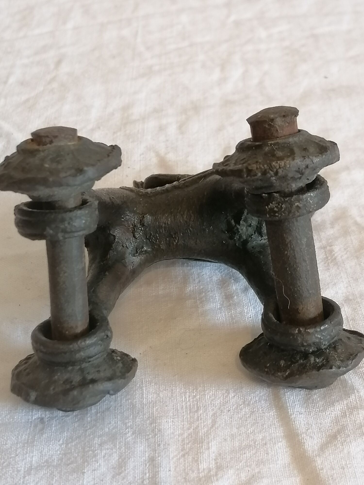 Old child's toy. Horse with bronze wheels. Ethnic object.