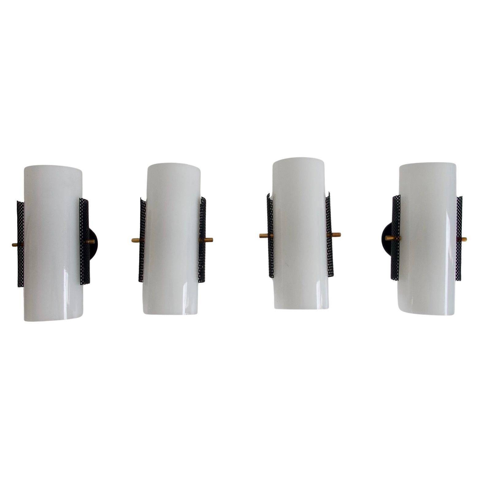 Set of four wall lights in white plexiglass and perforated black metal.