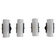 Set of four wall lights in white plexiglass and perforated black metal.