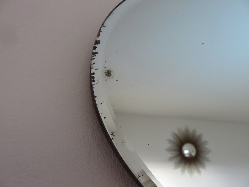 Beveled wall mirror, oval, on wood, with chain Art Deco years 30 40