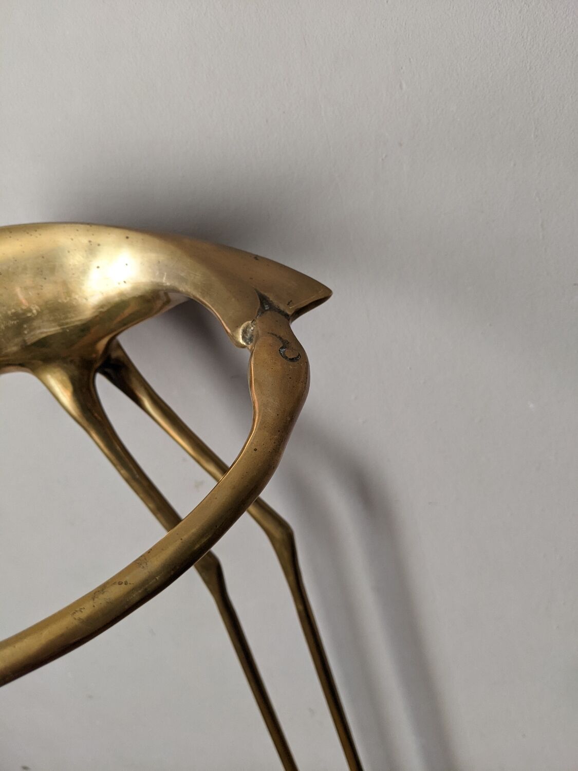 Curved brass umbrella stand