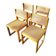 Four trendy tanned wooden chairs