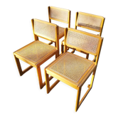 Four trendy tanned wooden chairs