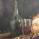 Natuere Morte (glass of wine, nuts, fruit, bread and knife)