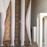 Rectangular Indonesian construction element with blue and yellow plant in carved wood