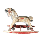 Former rocking horse with wheels