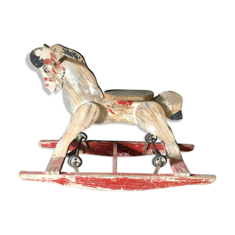 Former rocking horse with wheels