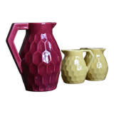 Raspberry carafe and two yellow pitchers