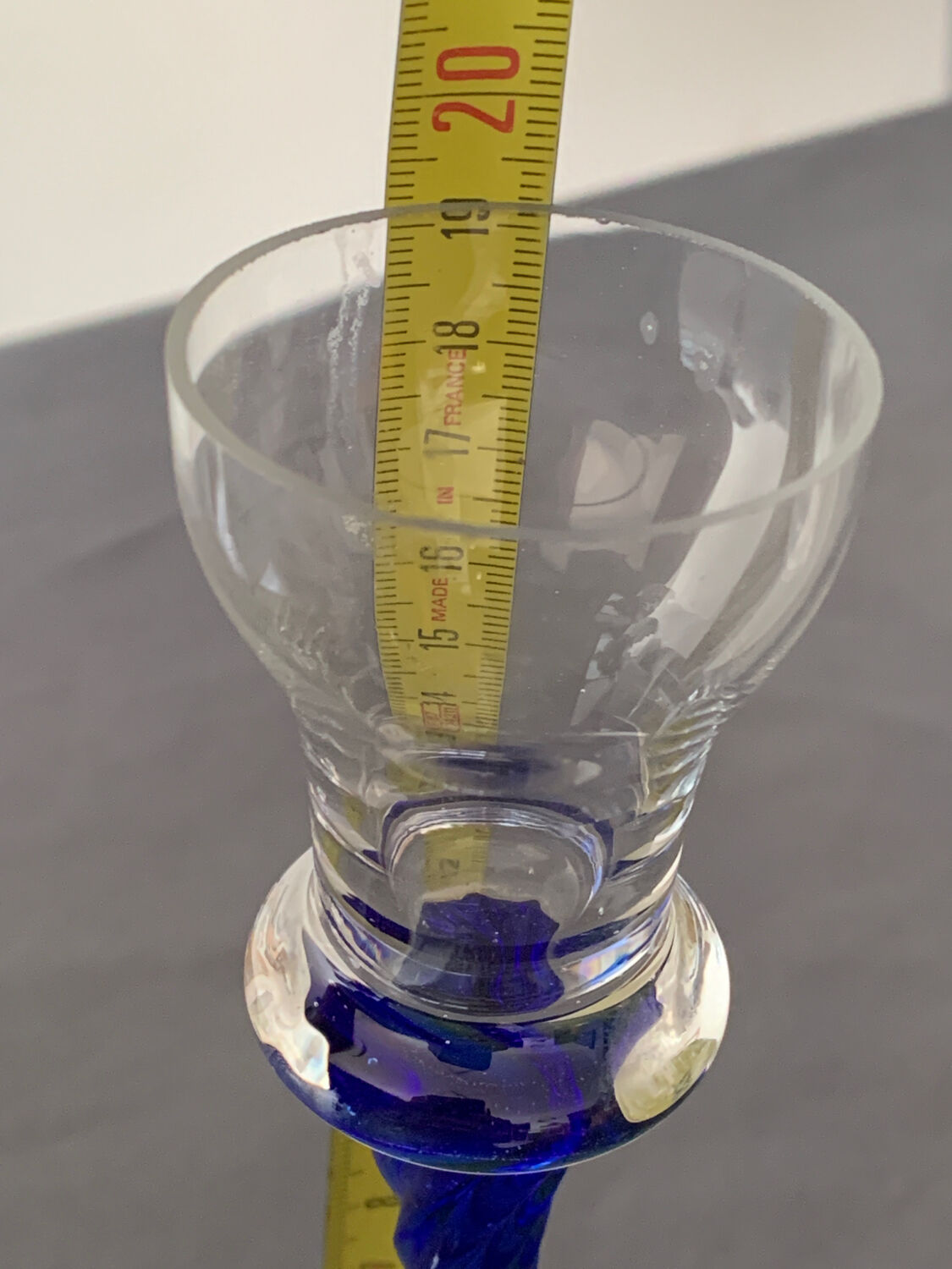 Blue glass candle holder with twisted stem. Candlestick candle